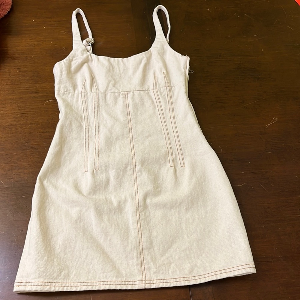 Cream with brown/dark orange stitching